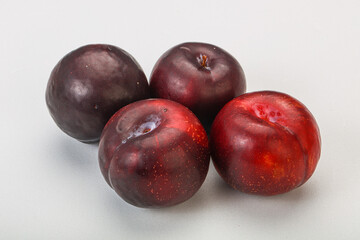 Ripe sweet plum fruit heap