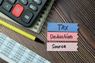 Tax Deduction Source write on sticky notes isolated on office desk.