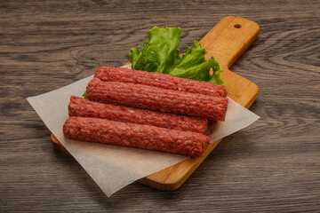 Raw beef sausages with spices