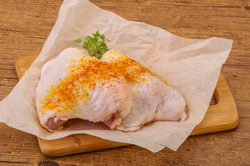 Raw chicken thigh with spices