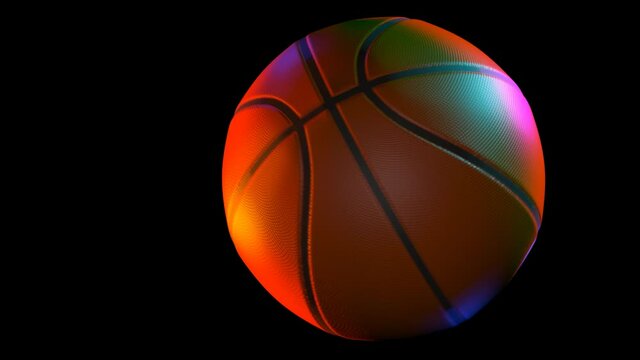 basketball spinning in multi colored light over black - 3d animation