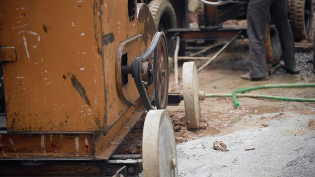 A close up of a concrete mixer's mechanism