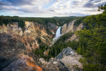 lower falls of the yellowstone national park at sunset, wyoming, usa