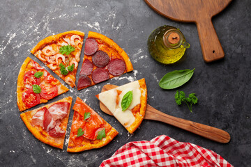 Tasty slices of different pizza