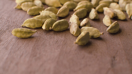 Cardamom seeds on the wooden table