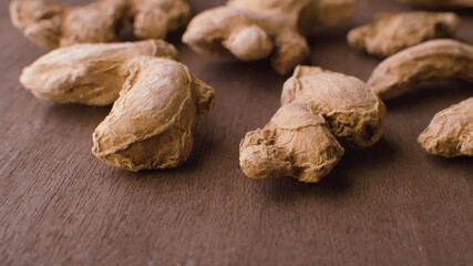 Ginger roots on the wooden table