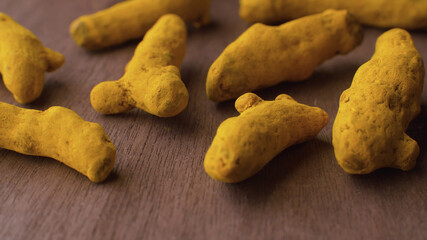 Turmeric roots on the wooden table