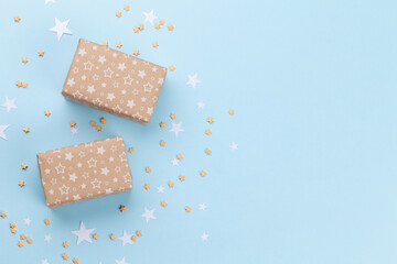 Christmas gift boxes over blue background