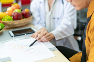 Young Asian man come to meet the nutritionist in hospital and talking about dieting and eating. 