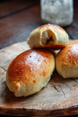 Freshly baked pies on a glass stand with a napkin. Close-up of baked pies