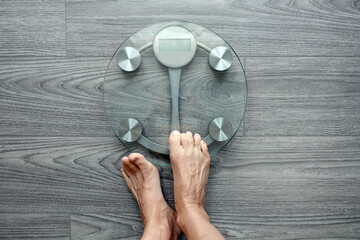 Human feet on electronic scales