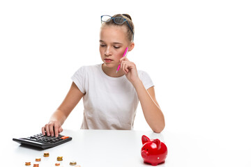 Portrait of Blond Teenage Girl Posing With Coins and Moneybox. Calculating Income With Calculator For Savings.