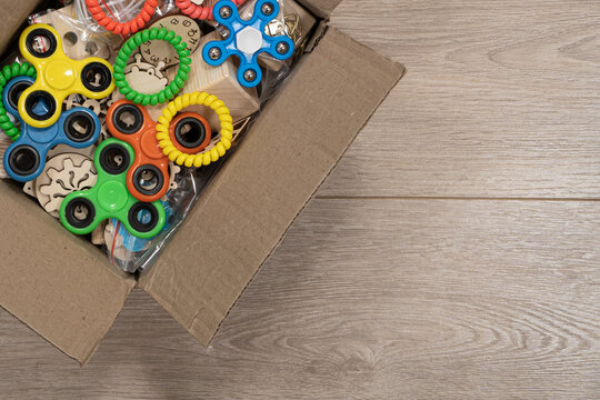 Cardboard box with wooden parts for handmade and multi-colored spinners . Warm and cozy atmosphere. Made by hand and with love. Handmade christmas gifts. Copy space