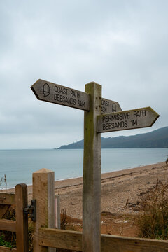 Portrait view of sign post on the Devon coastal path popular with walkers, hikers, bird spotters and photographers for beautiful scenery and nature. Sign post directs to Beesdands coast path