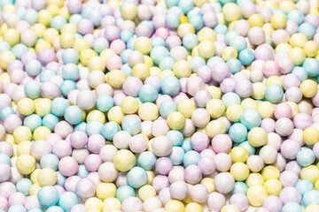 Purple, yellow, blue plastic balls.