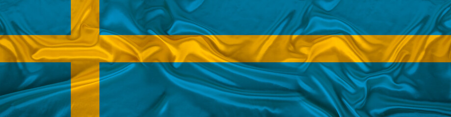 long panorama of the national flag of the state of Sweden on beautiful silk, the concept of tourism, emigration, economy, politics, civil rights and freedoms