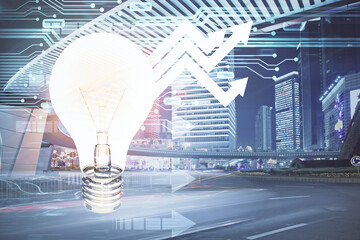 Multi exposure of bulb hologram drawing and cityscape background. Concept of idea.