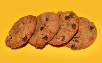 Delicious Chocolate Chip Cookies on yellow background