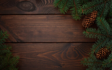Christmas tree, cones on a wooden brown background.Copy space for your text. Flat lay. New year christmas background
