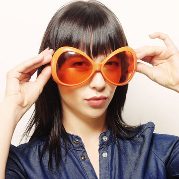 happy woman with big orange sunglasses