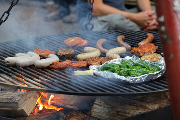 Outdoor barbecue with saugages open fire