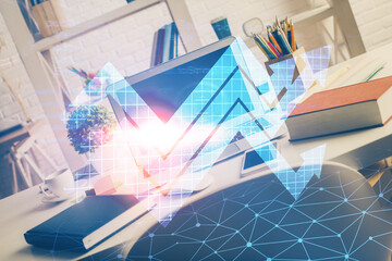 Computer on desktop with point up arrows hologram. Double exposure. Concept of success.