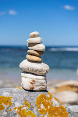 Balancing of white pebbles on top of each other, space for copy