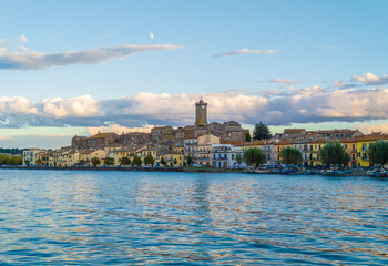 Obraz premium Marta (Italy) - A little medieval town on Bolsena lake with suggestive tower in stone; province of Viterbo, Lazio region. Here a view at sunset.