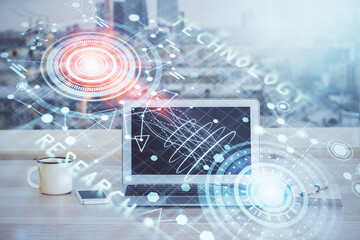 Double exposure of desktop computer and technology theme hologram. Concept of software development.