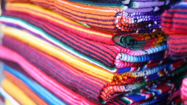 Colorful mexican wool serape blankets texture. Woven ornamental vivid textile with authentic latin american pattern. Striped multi colored fabric for poncho and sombrero. Hispanic indigenous style