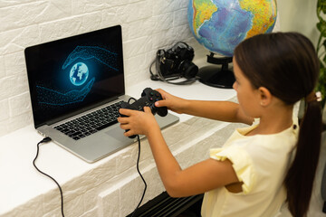 little girl playing games with laptop computer and joystick controller © Angelov