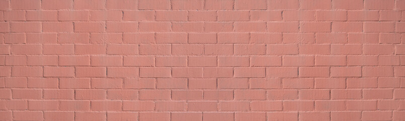 Wall of bricks painted in salmon color