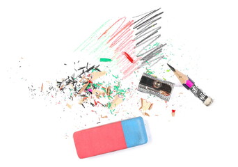 Colorful pencil shavings and tips isolated on white background, top view