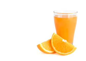 Glass of fresh orange juice with fresh orange slices cut in half on white background with copy space, banner
