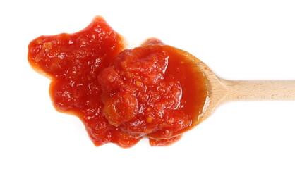 Tomato sauce with chopped chunks in wooden spoon isolated on white background, top view