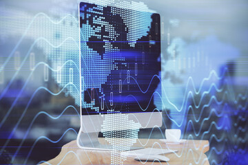 Forex market graph hologram and personal computer on background. Multi exposure. Concept of investment.