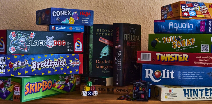 BERLIN, GERMANY - Sep 06, 2020: Books and many different packs of board games.