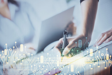 Double exposure of woman's writing hand on background with data technology hud. Big data concept.