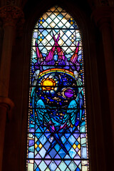 stained glass window in church with celestial theme