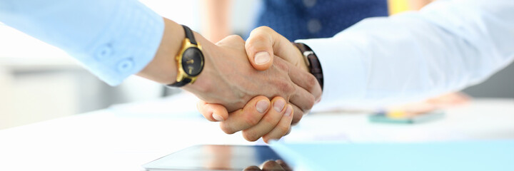 Handshake between businessman and businessman at meeting in office. Successful business partnership concept