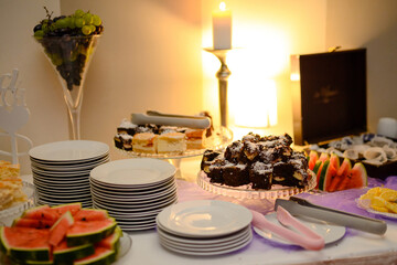 Delicious sweets on candy buffet. Wedding bakes on trays