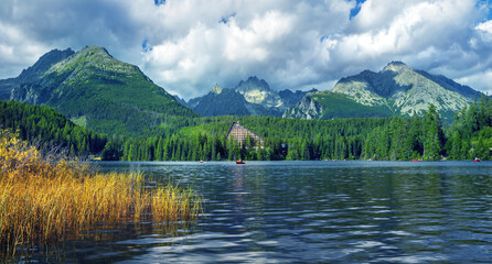 Fototapeta na wymiar Panorama of High Tatras mountains - National park and Strbske pleso (Strbske lake) mountain lake in Slovakia