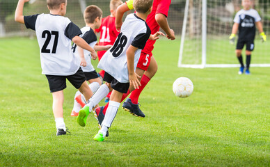 Boys play soccer sports field