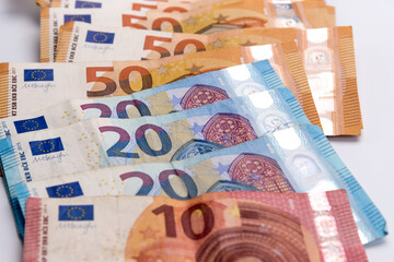 Cash banknotes euros scattered , close up