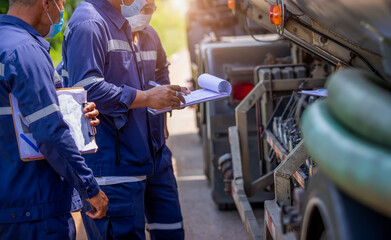 Truck drivers hand holding clipboard Check the product list, Preforming a pre-trip inspection on a...