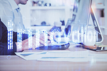 Double exposure of data internet theme hologram with man working on computer on background. Concept of innovation.