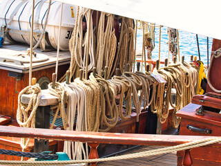 Nautical tackles and equipment of the old tall ship. Rigging ropes and rope ladder on the mast of sailing vessel