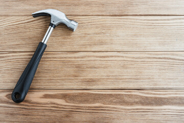 set of tools. Building tool. Hammer and Wrench on a brown wooden background.	
