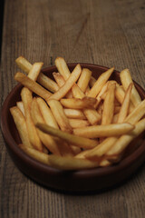 french fries on a wooden table