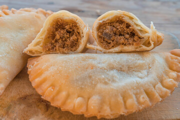 Typical Colombian empanadas on a wooden base